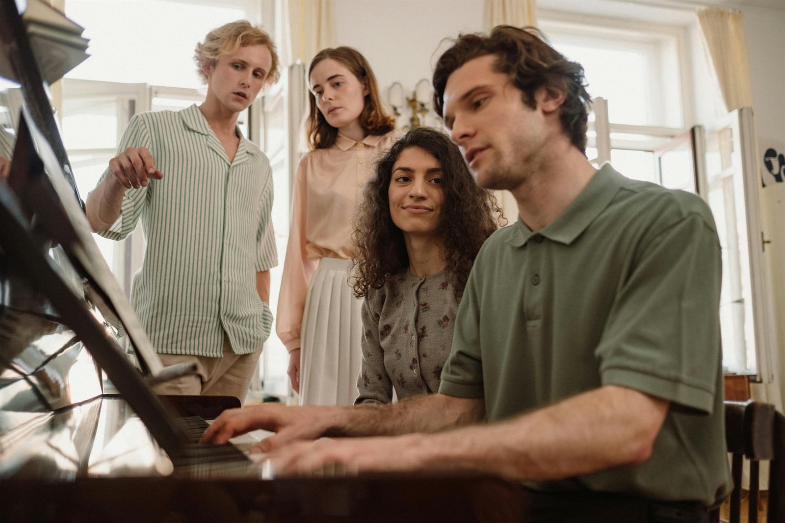 People enjoying the piano